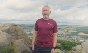 Richard Benson posed on top of a hill.